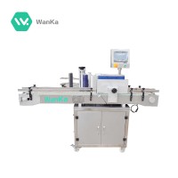 Round bottle filling capping and sticker labeling machine